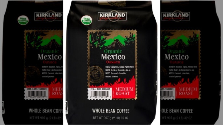 Organic Mexico whole bean coffee on white background
