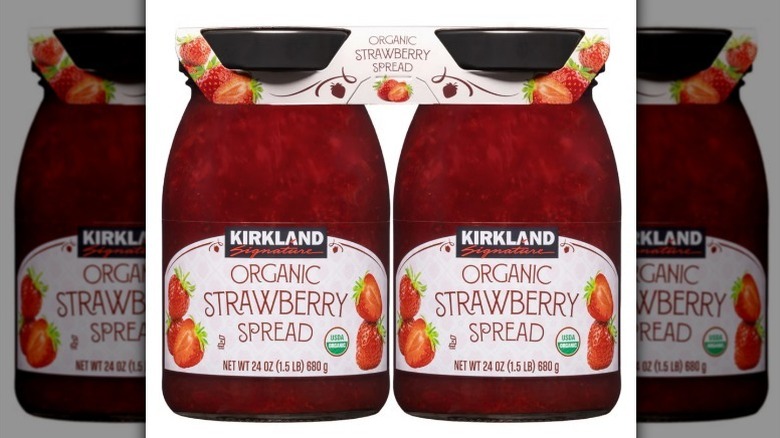 Organic strawberry spread on white background