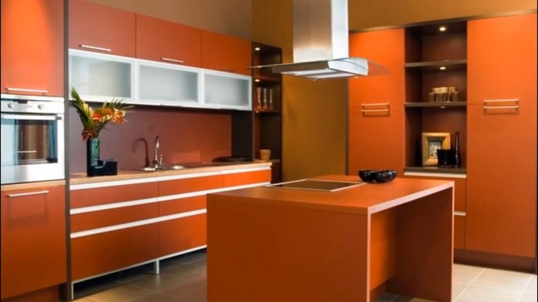 A modernist kitchen in burnt orange