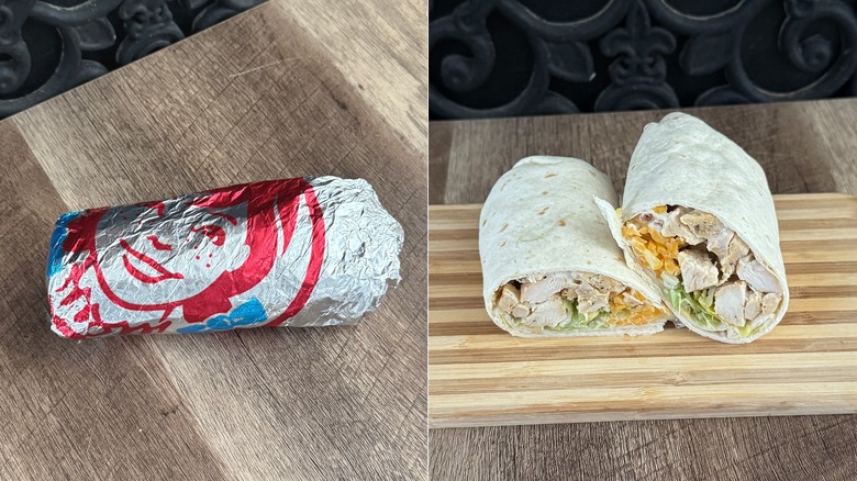 Wendy's Grilled Chicken Wrap, in its packaging and sliced in half to show the filling