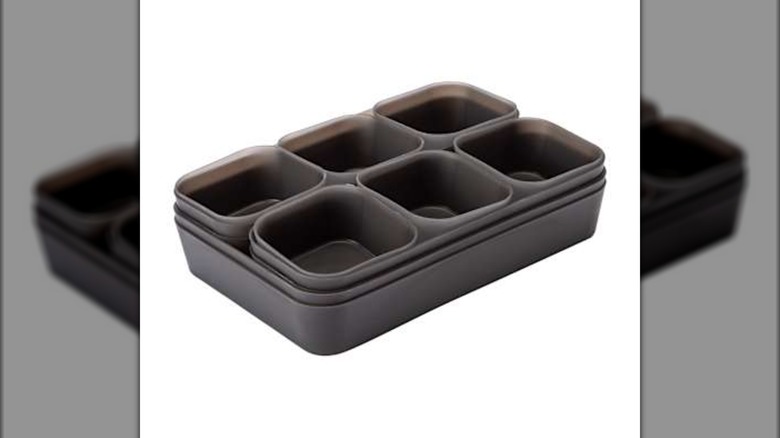 Modular set of plastic drawer organizers stacked within itself