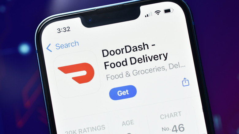 A close-up of an iPhone with the DoorDash app open on the screen