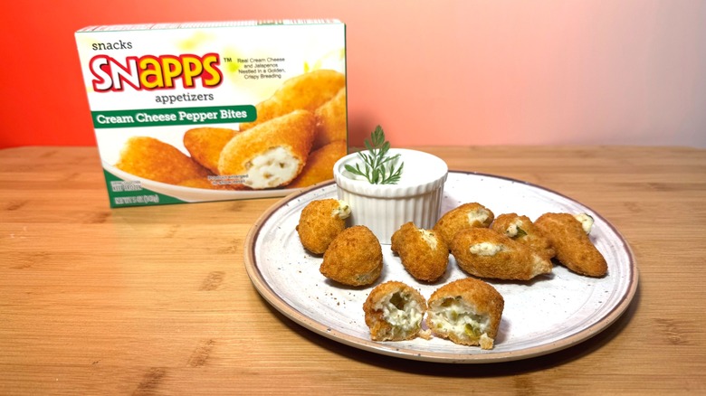 Plate of jalapeño poppers and Snapps box