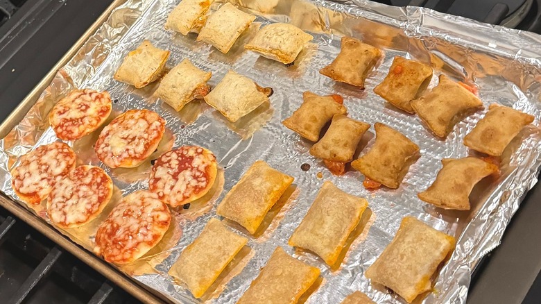 Tin foil-lined pan with an array of pizza bites