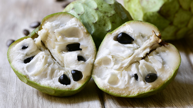A halved cherimoya, showing the inside of the fruit