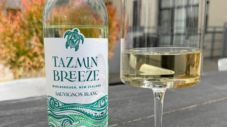 Tazmin Breeze bottle with wine poured in a wine glass