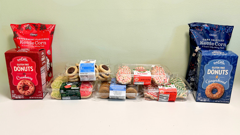 Nine holiday treats from Aldi arranged together on a green and white background