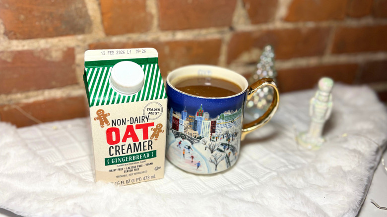 A plate of creamer next to a box against a brick background