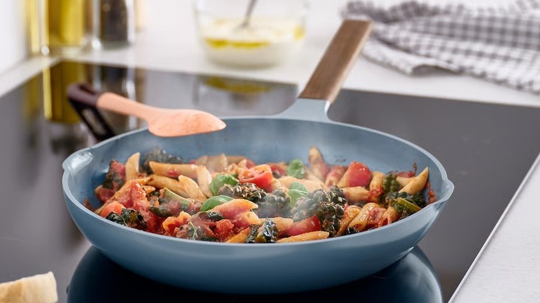 blue frying pan with brown handle