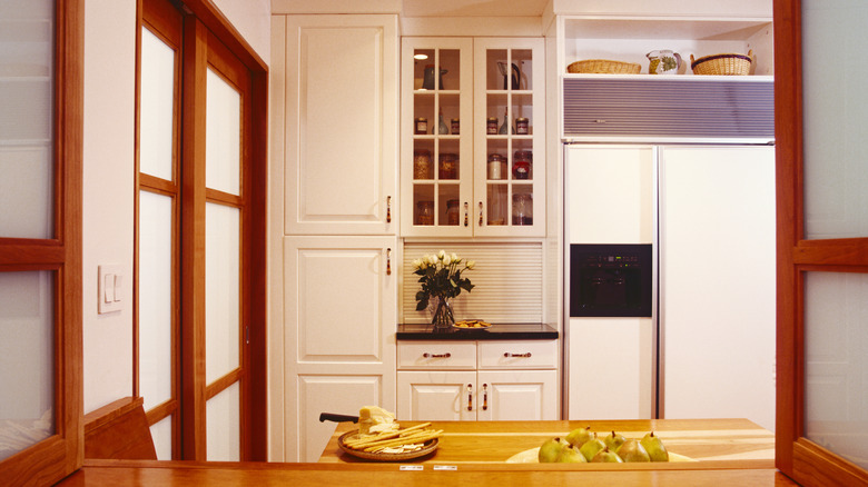White and brown kitchen with 1990s styling