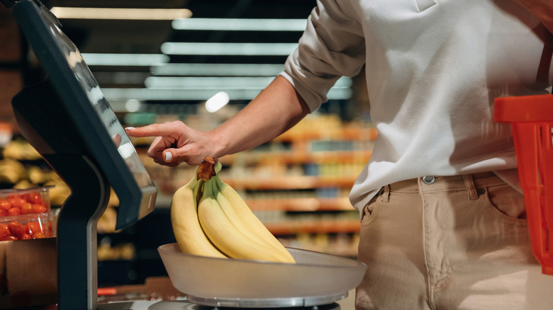 Bananas being weighed at a grocery store