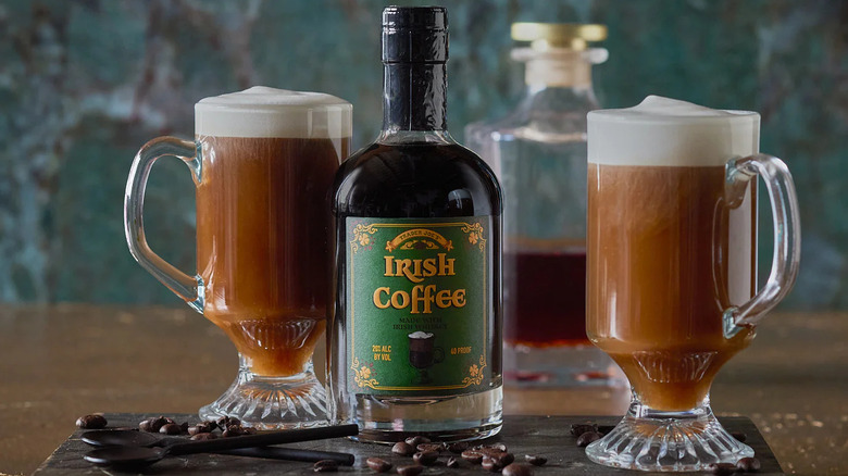 Bottle of Irish coffee with mugs