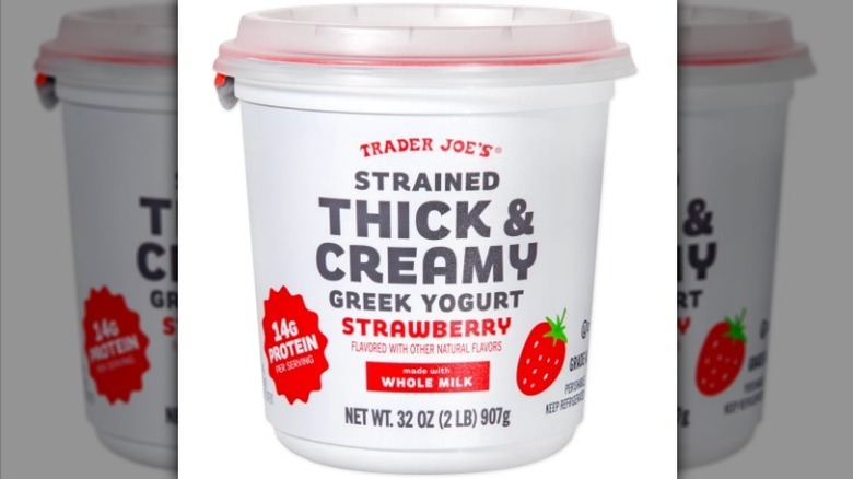 Strawberry Greek yogurt tub on white background