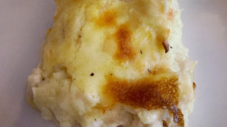 Serving of chicken pudding on a plate