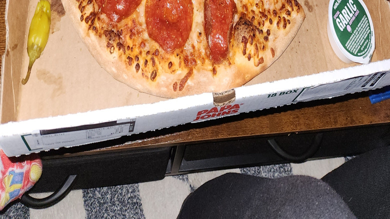 An open Papa Johns box with a large pepperoni pizza