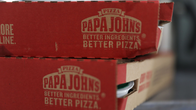 Two Papa Johns pizza boxes stacked on top of each other