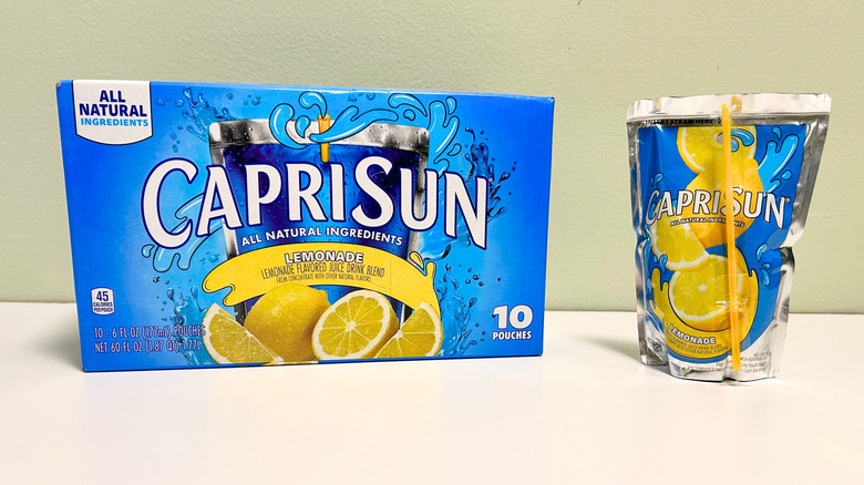 A box of Capri Sun Lemonade next to a lemonade pouch