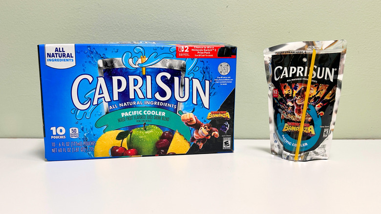 A box of Capri Sun Pacific Cooler next to a pouch of Pacific Cooler juice