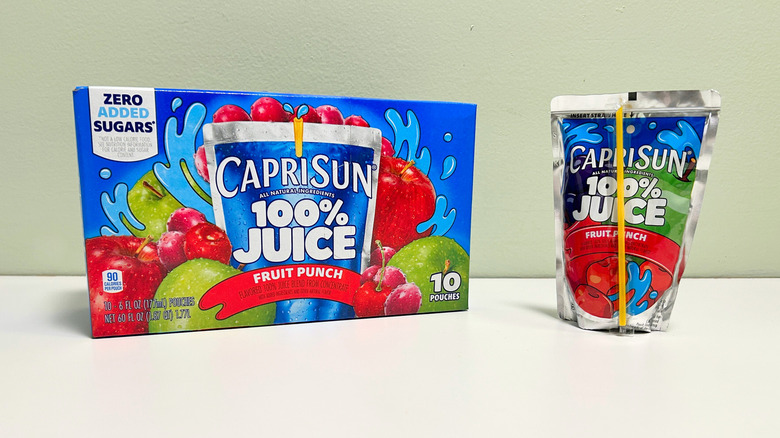 A box of Capri Sun Fruit Punch next to a fruit punch pouch