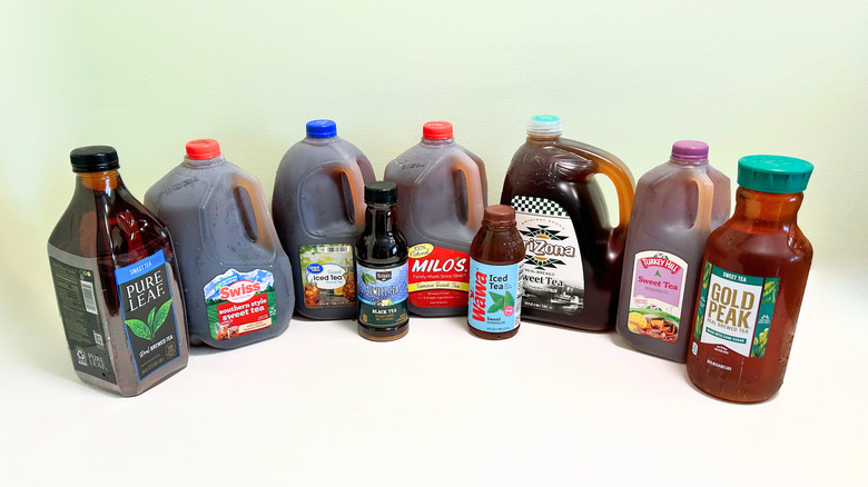 Several bottles of popular sweet tea brands lined up in a row