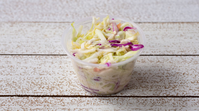 A small cup of fast food coleslaw