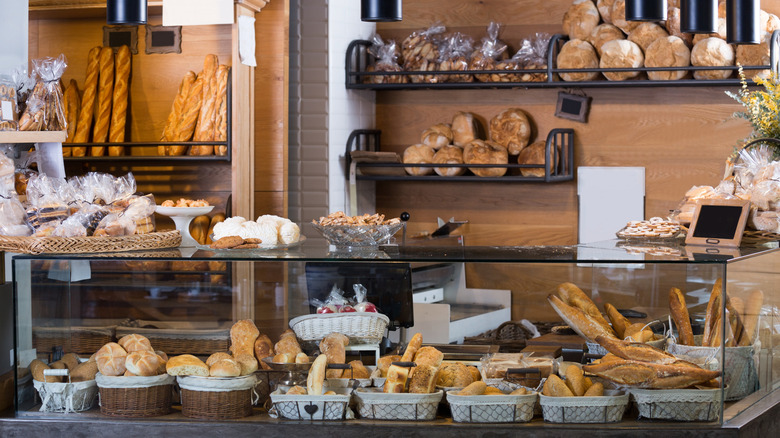 Freshly baked breads and buns arranged inside a bakery