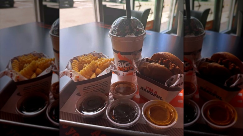 A chicken sandwich, fries, dips, and a drink from Big Chicken