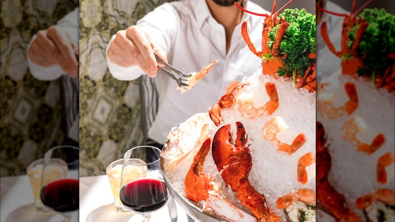 Man eating from seafood tower at Ruth's Chris Steak House