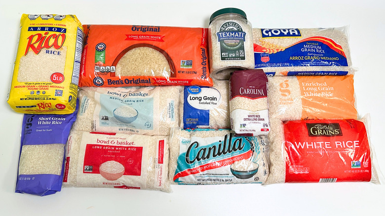 Several store-bought white rice brands arranged together