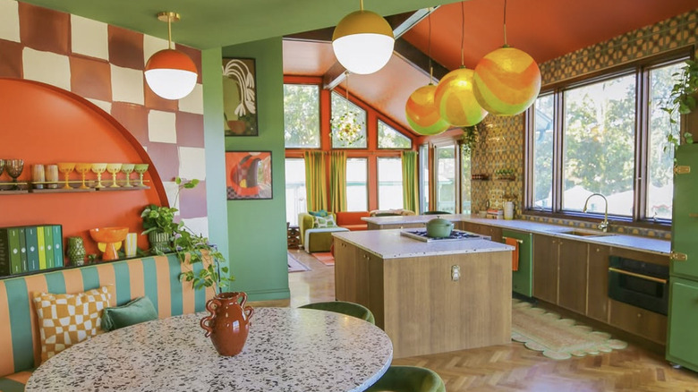 A large, eclectic midcentury kitchen with patterns in green and burnt orange
