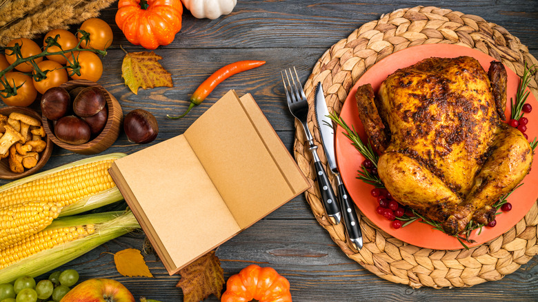 book with roasted chicken and pumpkins