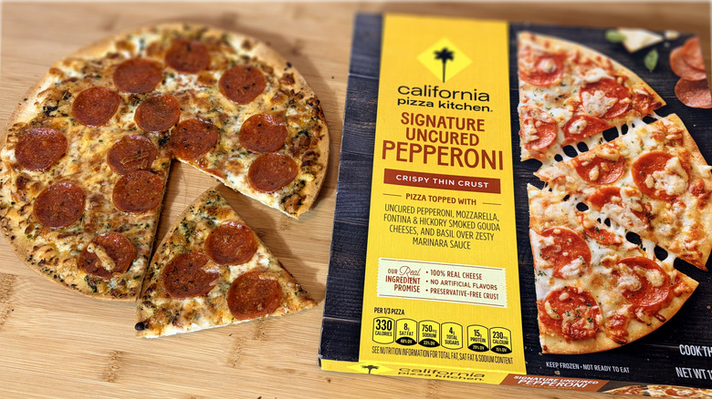 cooked cpk pepperoni pizza on left and boxed pizza on right