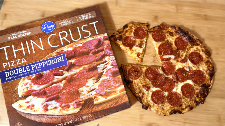 boxed kroger pepperoni pizza on left and cooked pizza on right