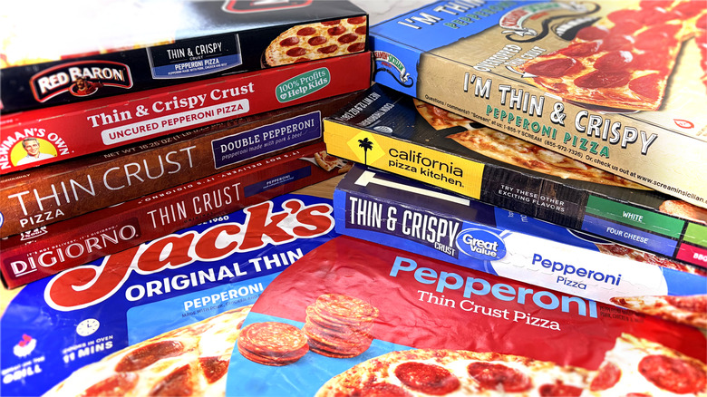 stacked boxes and packages of frozen pizza