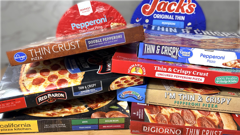 stacked boxes and packages of frozen pizza