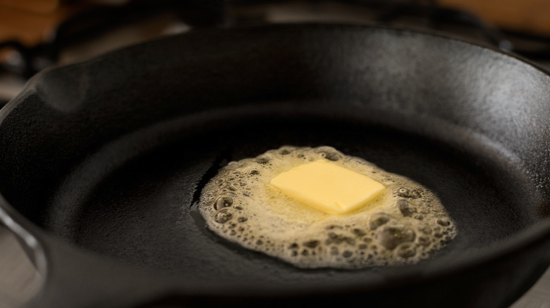 butter melting in iron skillet