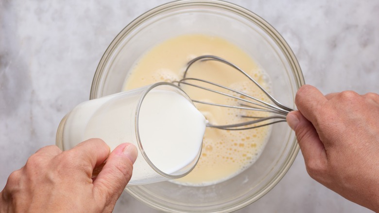 whisking milk into batter