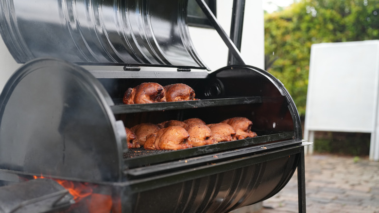 Chicken cooking in a smoker