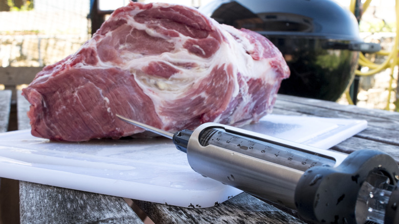 Meat with a syringe of liquid