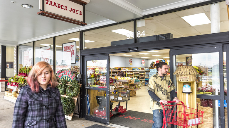 Two shoppers leave a Trader Joe's with shopping carts