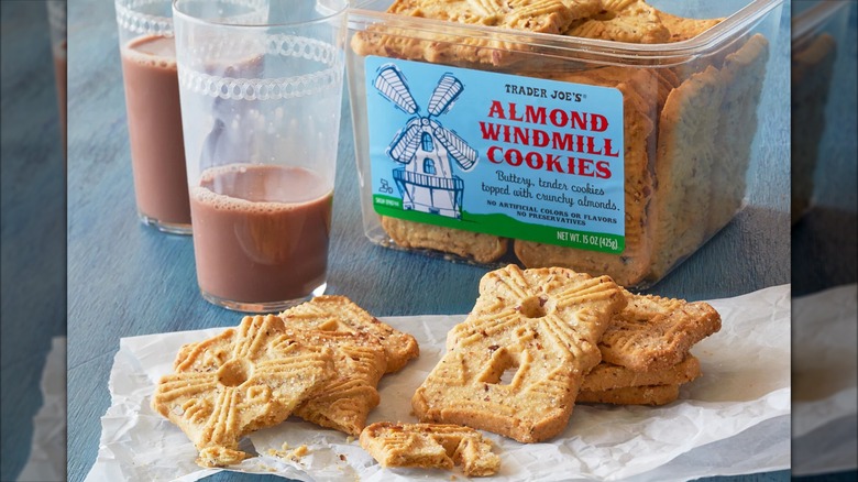 Trader Joe's Almond Windmill Cookies on a plate with glasses of chocolate milk