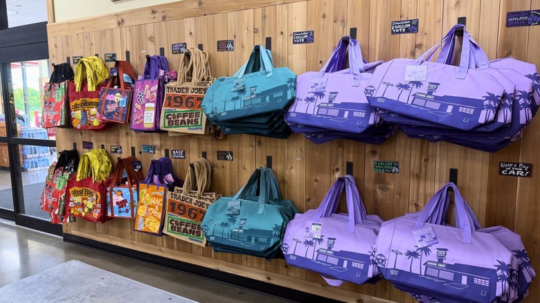 An assortment of colorful Trader Joe's reusable shopping bags for sale