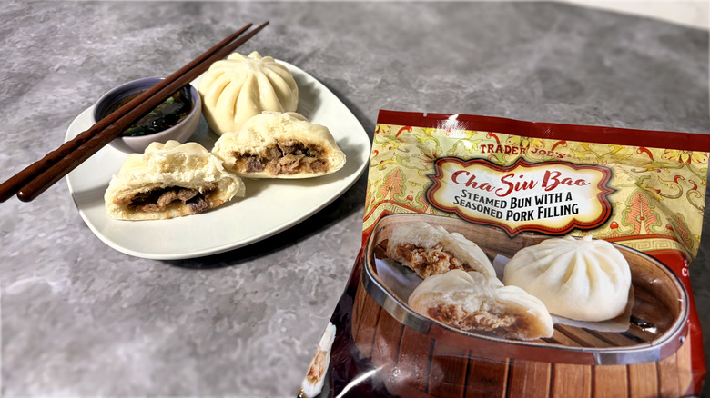 package and plate of cha siu bao steamed buns with dipping sauce and chopsticks