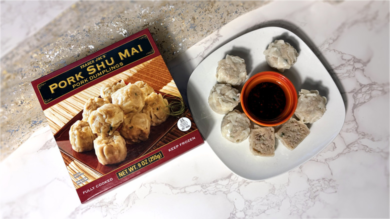 package and plate of pork shu mai dumplings with dipping sauce