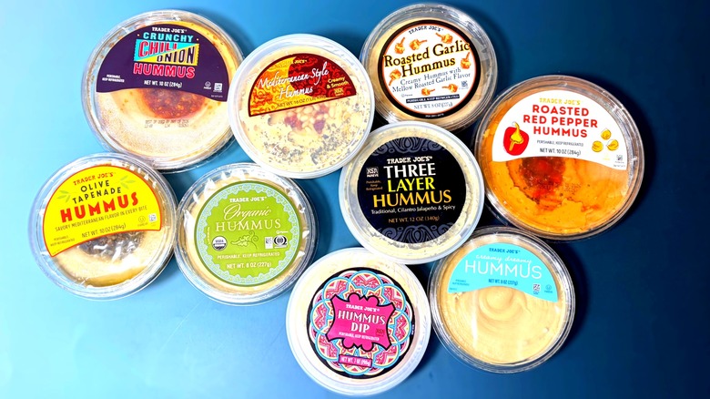 Top-down view of various Trader Joe's hummus varieties