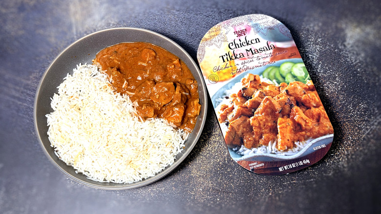 Packaged and cooked and plated chicken tikka masala and rice