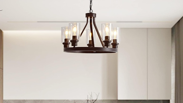 metal round light fixture hanging from ceiling