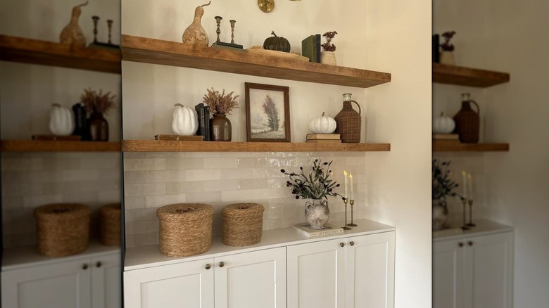 open wooden shelving with objects on them