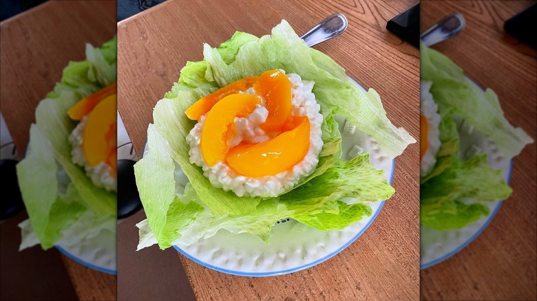 Cottage cheese and peaches on a lettuce bed