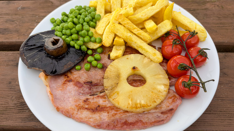 Ham slice, pineapple, and sides